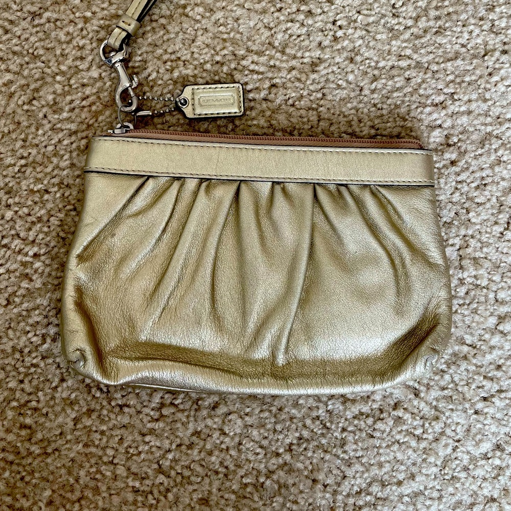 Gold coach wristlet